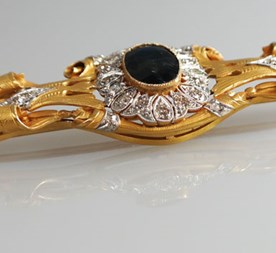 Gouden Art Nouveau broche met diamant