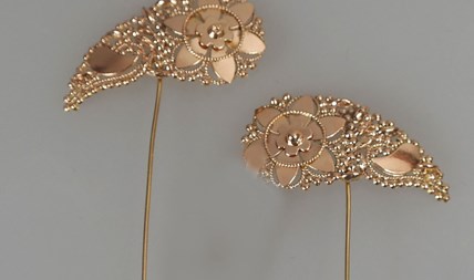 Gouden mutsenspelden