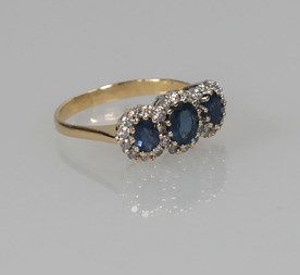 18-karaats gouden ring met saffier en diamant